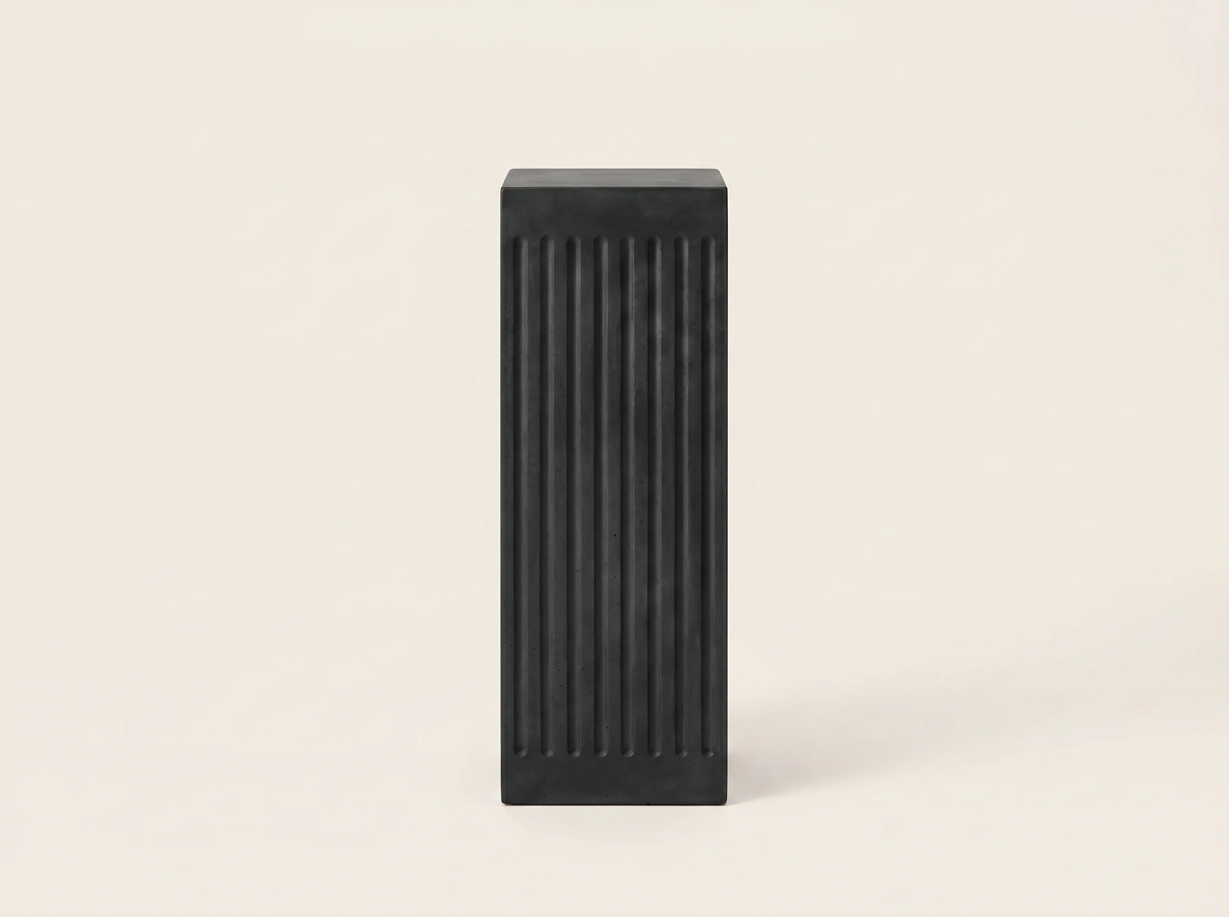 Coronado Fluted Concrete Side Table in Black Cement, In situ